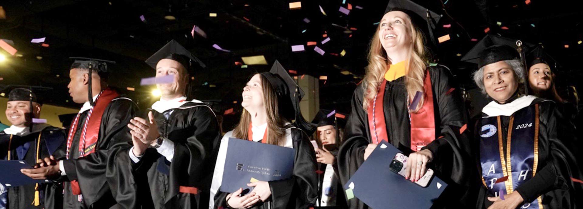 graduates at commencement